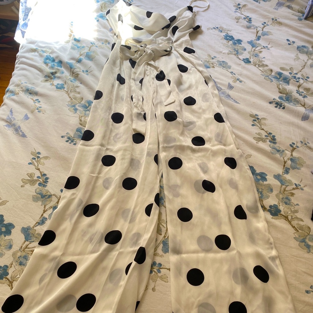 White polka dot jumpsuit w/ cowl neck.